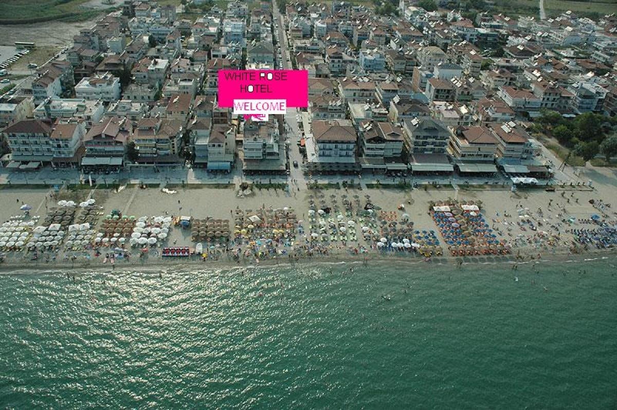 The beach at Olympiaki Akti from above, with the hotel a row back from the sand